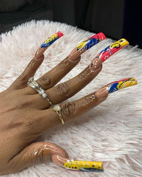Curved barbells lend to a whimsical vibe, and picking bright-colored end pieces helps to create a feminine look. . 90s curved nails